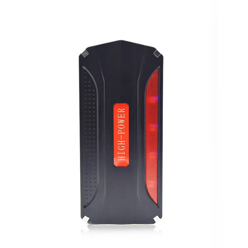 Black and red 12V vehicle emergency jump starter power supply unit on a white background.