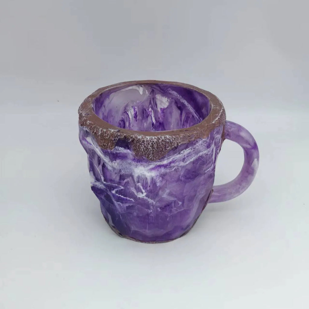 Resin mineral crystal coffee mug with handle in purple colour showing transparent construction