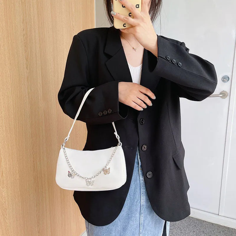 Horizontal square PU leather chain crossbody bag in light blue with an external pocket.