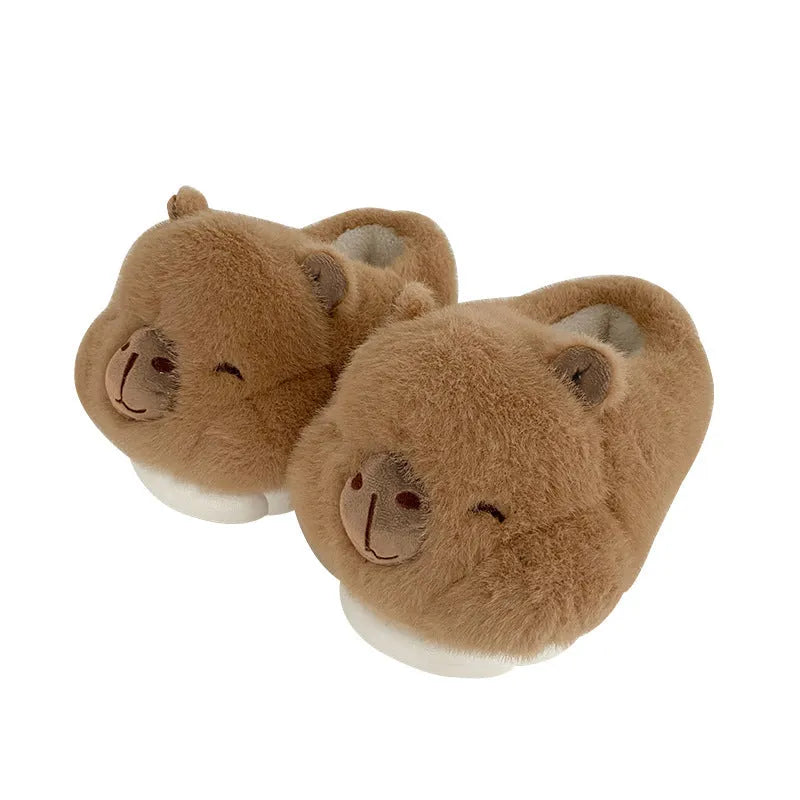 Light brown women's winter slippers with cartoon pattern, plush upper, and round toe.
