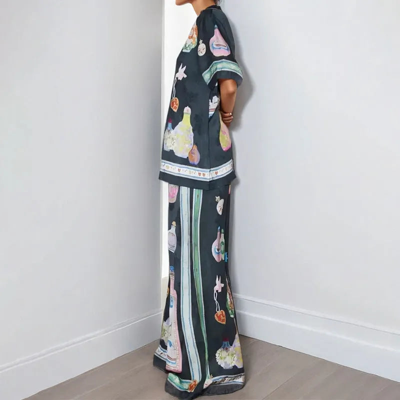 Black two-piece cardigan and pants set with cartoon animation pattern for women