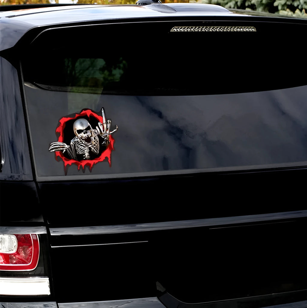 Close-up of a colourful reflective metal skull vinyl car sticker with a broken shell pattern.
