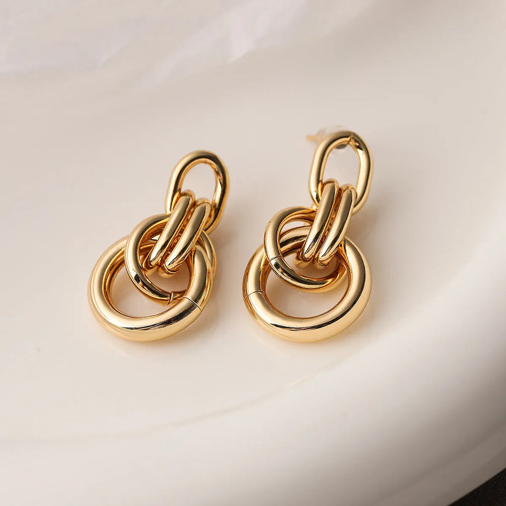 Gold geometric earrings with irregular shape and high-profile design for women