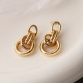 Gold geometric earrings with irregular shape and high-profile design for women