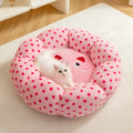 Pink dot fabric princess-style cat bed cushion shown in two sizes for small and medium cats.