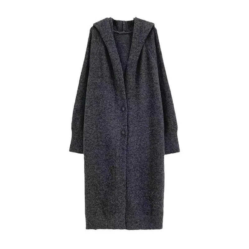 Women's long hooded knitted cardigan in oatmeal colour, showing below-knee length and loose fit.
