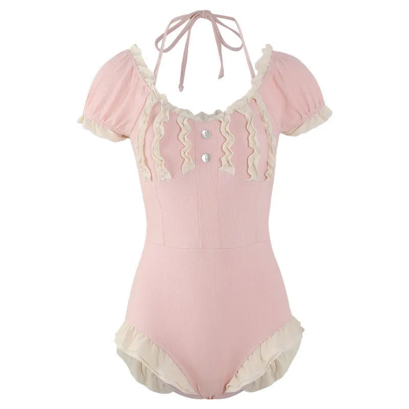 Women's pink conservative one-piece nylon swimsuit shown front view