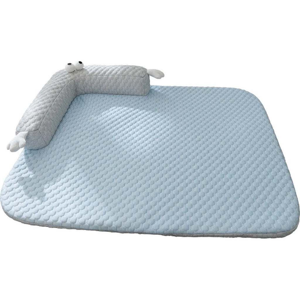 Blue and yellow monster face design pet bed for dogs and cats on a wooden floor
