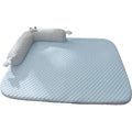 Blue and yellow monster face design pet bed for dogs and cats on a wooden floor