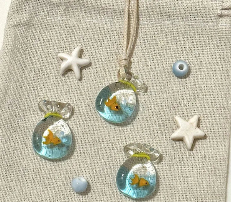 Women's joker charm necklace with coloured glaze pendant on a cotton and linen clavicle chain.