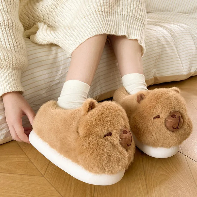 Light brown women's winter slippers with cartoon pattern, plush upper, and round toe.