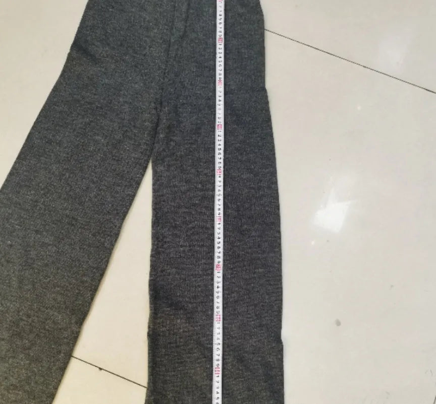 Women's acrylic two-piece suit with side-slit sweater top and matching trousers in dark grey