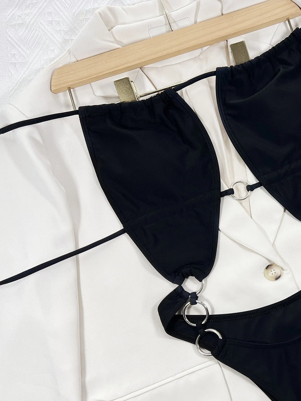 Black sleeveless one-piece swimsuit for women in solid colour design