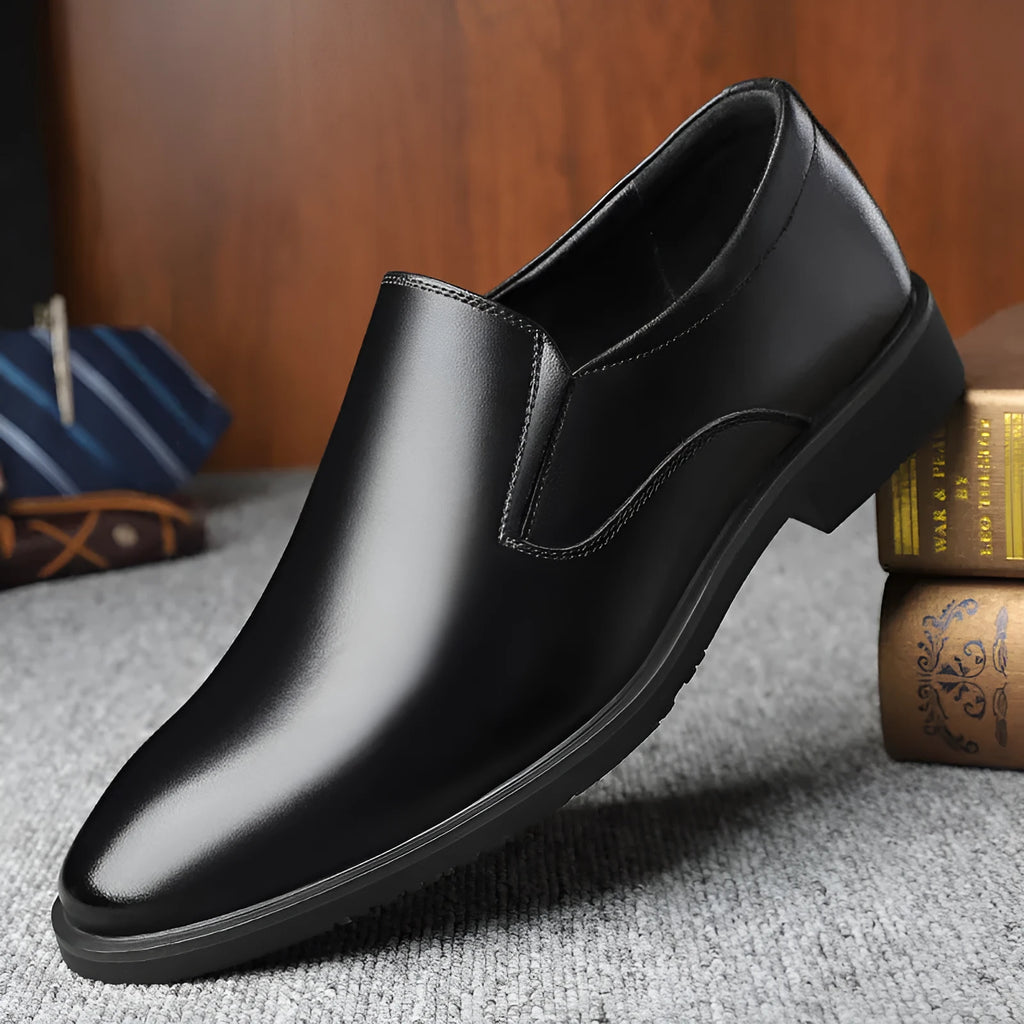 Men's black business casual slip-on shoes with a leather toe cap and sewing line detail.