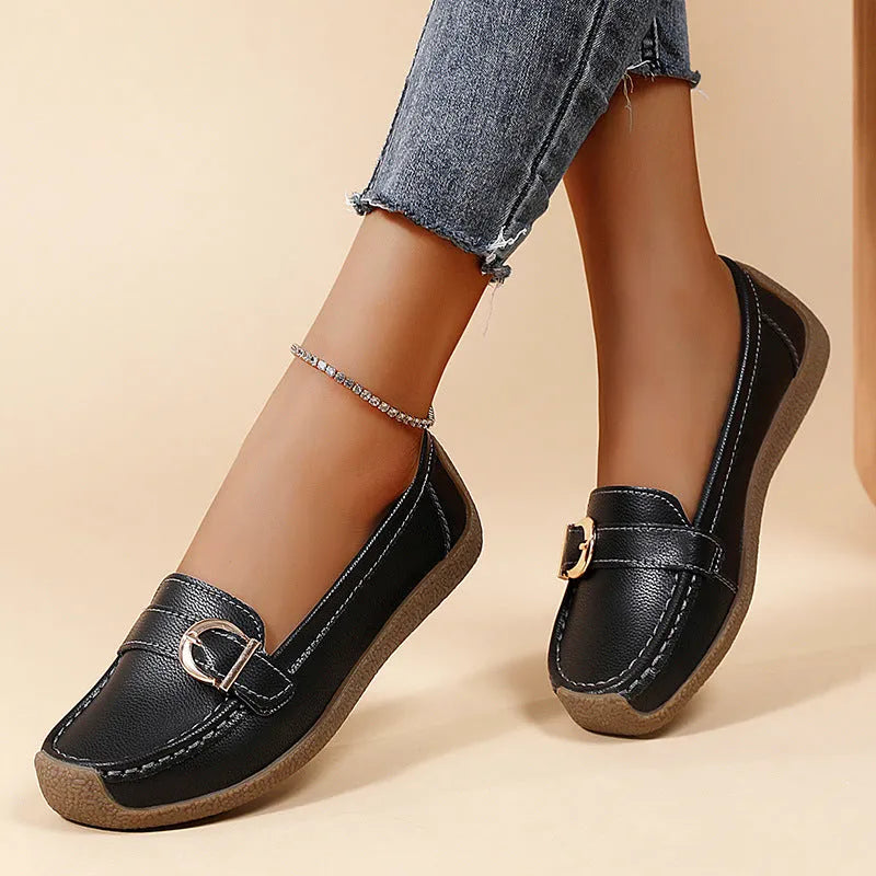 Women's beige casual loafers with a round toe and flat heel on a soft beef tendon sole.