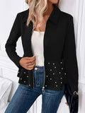 Women's black loose-fit coat with beaded heavy-duty zip and ruffle hem detail.