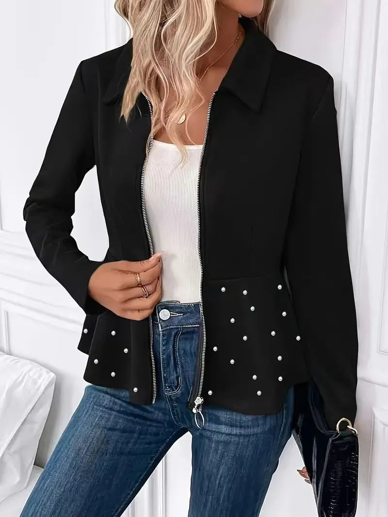 Women's black loose-fit coat with beaded heavy-duty zip and ruffle hem detail.