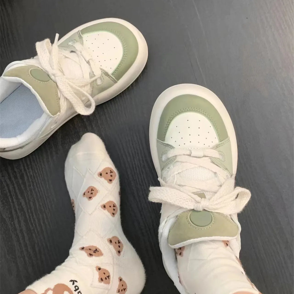 Green women's casual shoes with PU mesh upper, flat heel, and round toe.