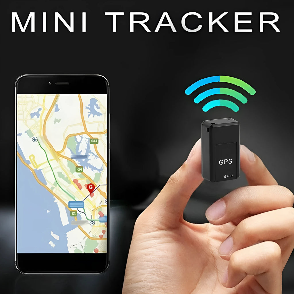 Black mini magnetic GPS tracker next to USB charging cable on a dark surface.