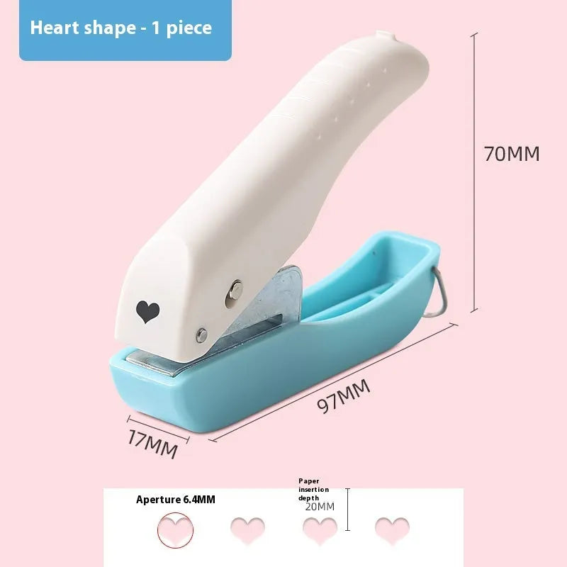 Small manual punching machine with four embossed pattern heads for paper crafts