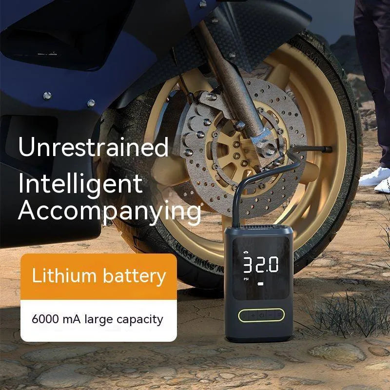 Black handheld wireless digital tyre inflator with LED display and flexible hose on a grey background.