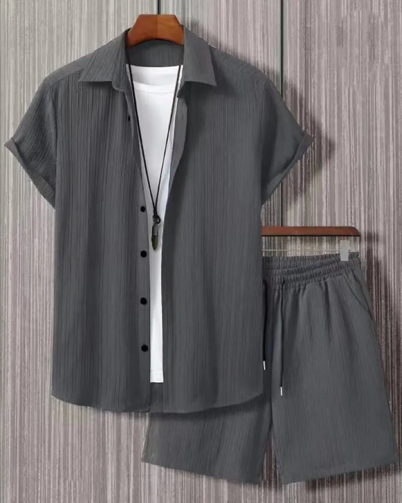 Jacquard patterned short sleeve shirt and matching shorts suit set on a hanger.