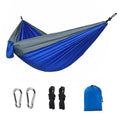 Blue nylon parachute cloth camping hammock measuring 270x140cm suspended outdoors