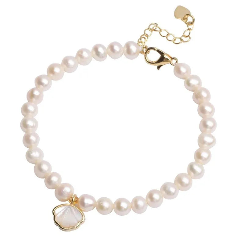 Freshwater pearl bracelet for women with 5-6mm pearls and fan design, available with elastic or chain closure