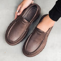 Men's black slip-on loafers with platform sole and round toe design