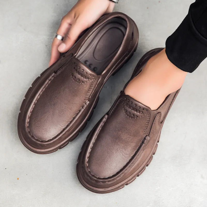 Men's black slip-on loafers with platform sole and round toe design