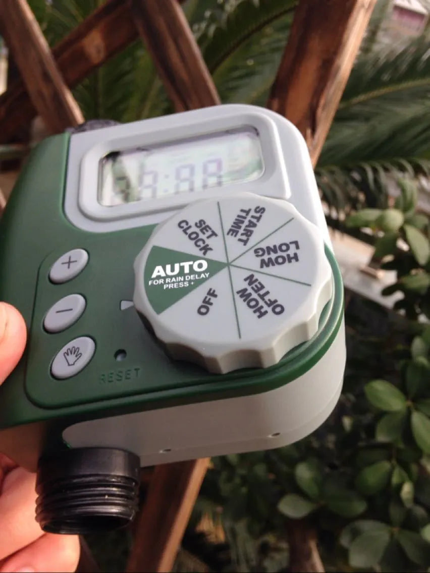 Green digital programmable garden hose faucet timer with large display and copper connector
