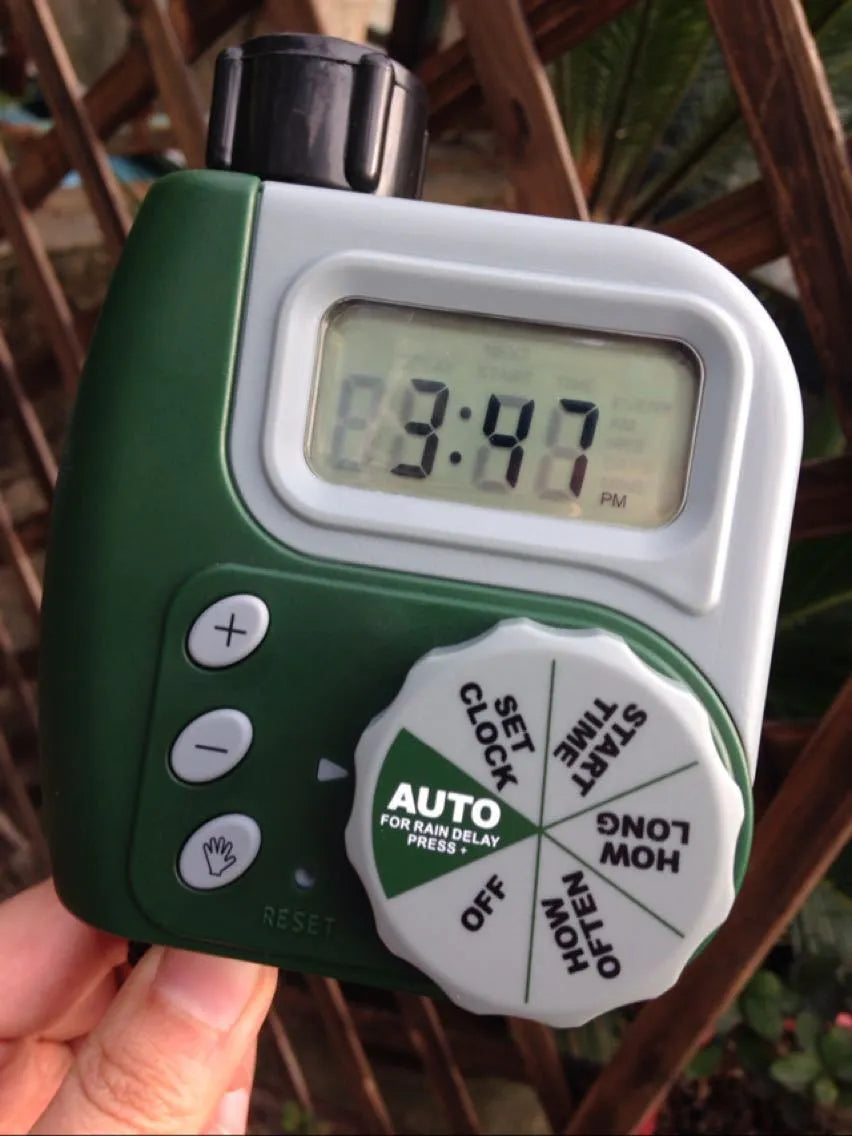 Green digital programmable garden hose faucet timer with large display and copper connector