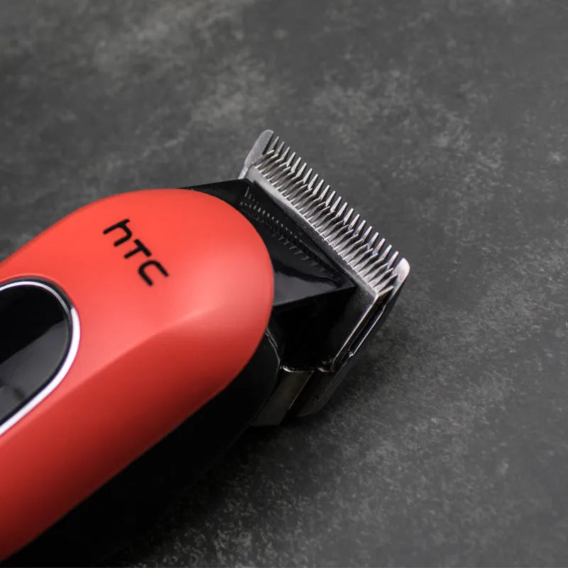 Black red and white waterproof digital hair clipper with brushless motor, four combs, and grooming accessories.