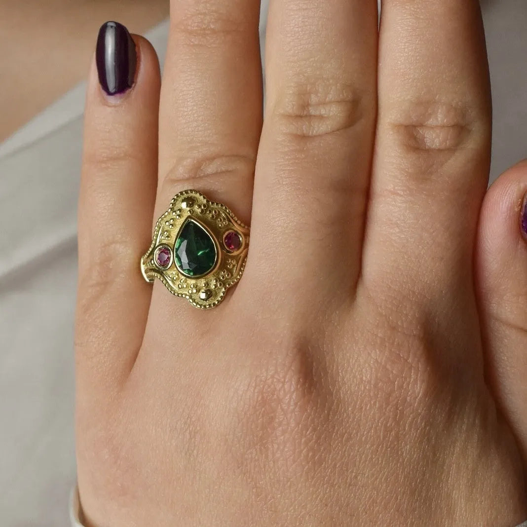 Golden geometric women's fashion ring on display showing electroplated finish and geometric design details