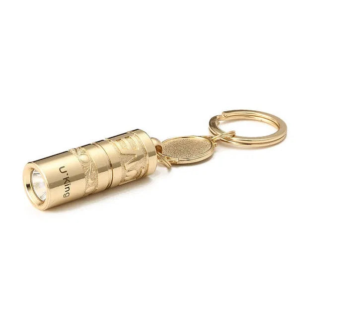Gold zinc alloy waterproof mini LED flashlight attached to a keyring.