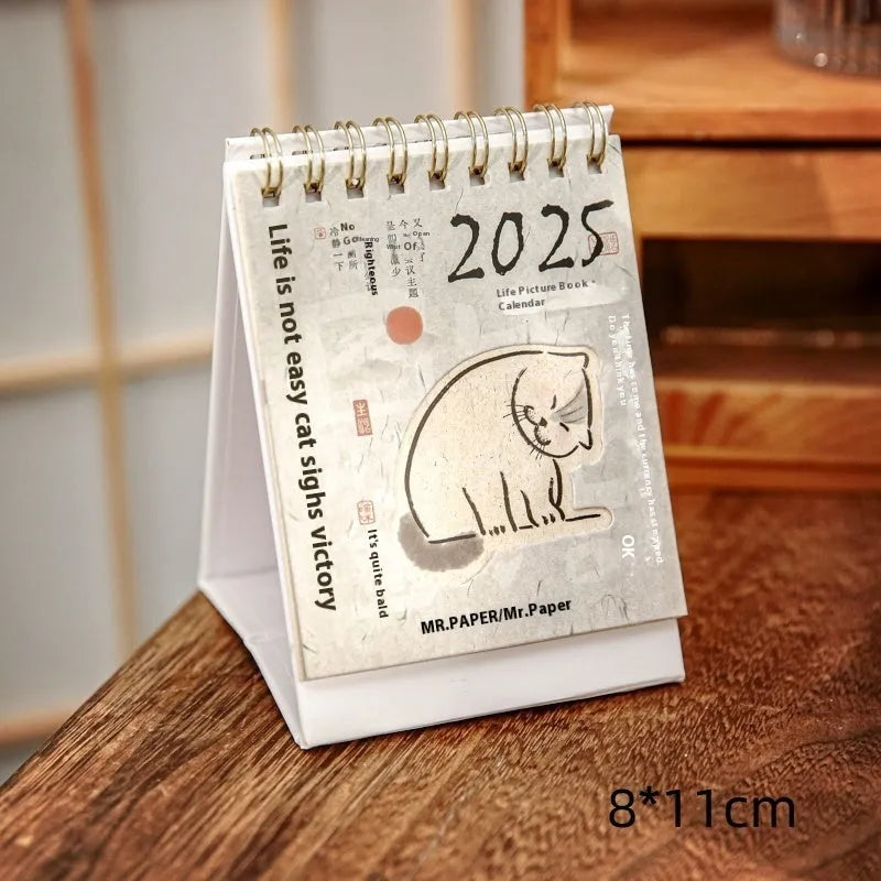 Coffee themed mini desk calendar for 2025 showing four different model designs on a desk.