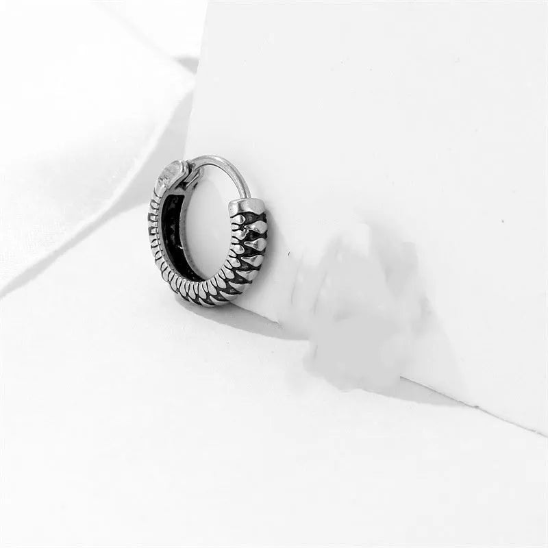 Round geometric retro twist earrings in titanium steel with stripe pattern, silver colour