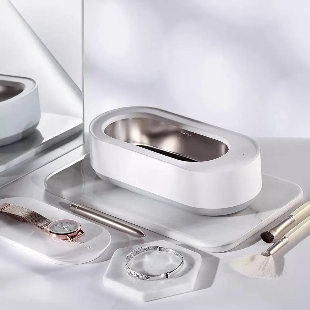 White portable ultrasonic cleaning machine with digital display and stainless steel tank.