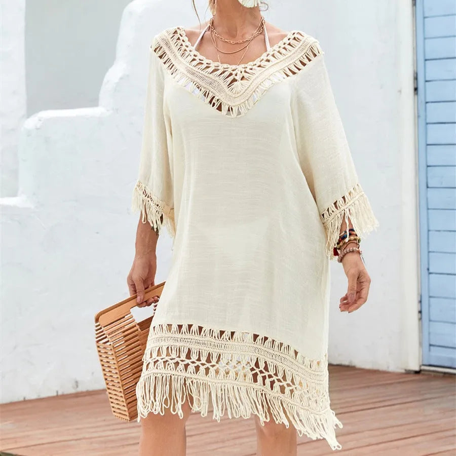 Apricot crocheted patchwork dress with mid-length skirt and half sleeves on hanger