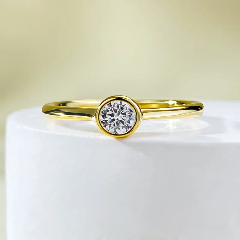 Minimalist silver crown-shaped ring with linear details, shown in gold and platinum finishes.