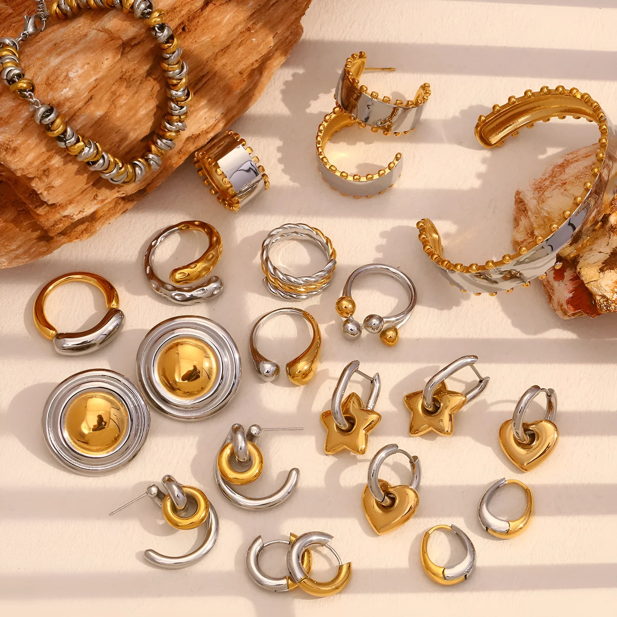 Gold electroplated jewellery set showing geometry-designed earrings, bracelet and necklace on stainless steel