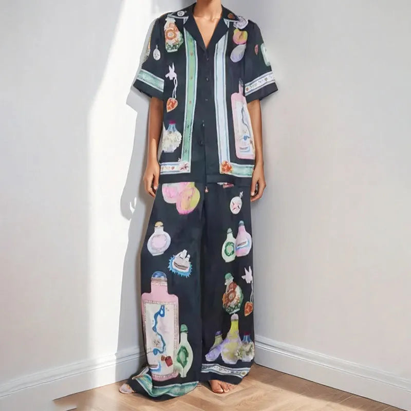 Black two-piece cardigan and pants set with cartoon animation pattern for women