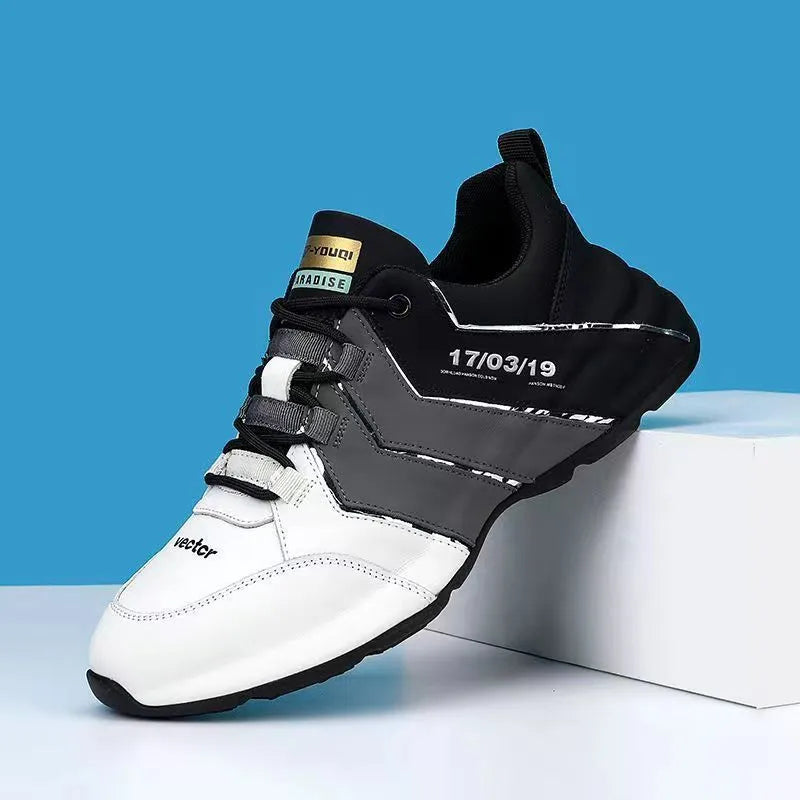 Men's black and grey low-top casual sneakers with thick plastic sole and lace-up front