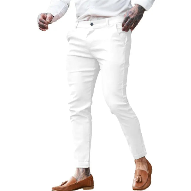Men's slim fit pencil trousers in cotton twill fabric with stretch, showing mid waist and tapered leg.