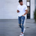Men's deep blue cotton jeans with distressed hole detailing showing loose fit and six size options