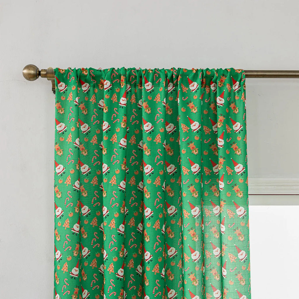 Green cotton Christmas curtain with printed snowman angel cartoon pattern measuring 1 metre length