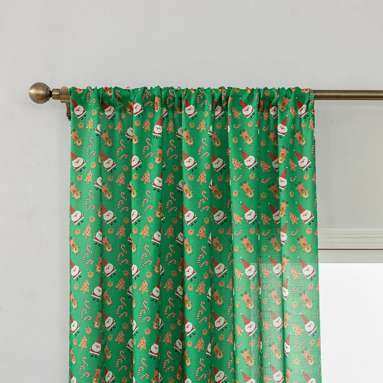 Green cotton Christmas curtain with printed snowman angel cartoon pattern measuring 1 metre length