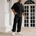 Men's apricot coloured cotton linen short sleeve shirt and matching casual trousers laid flat.