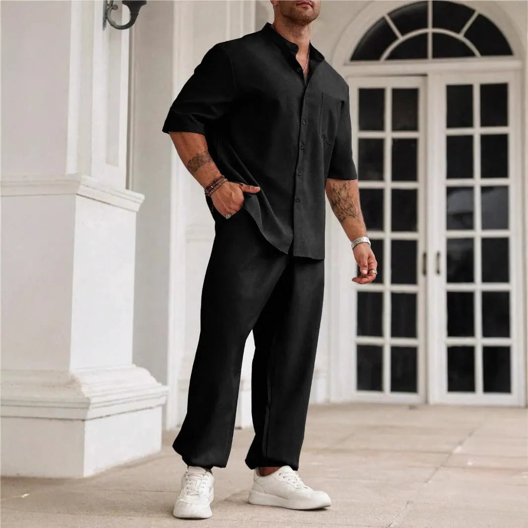 Men's apricot coloured cotton linen short sleeve shirt and matching casual trousers laid flat.