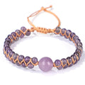 Handwoven geometric pull bracelet made from blue Tigereye stone beads with amethyst details